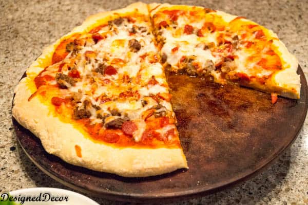 Use a pizza stone to make your Meat Lovers Pizza