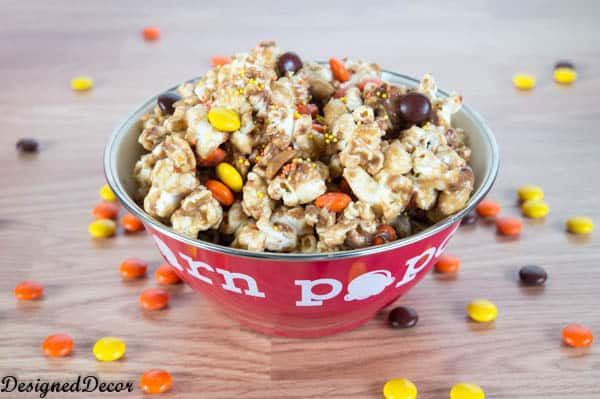 Peanut Butter Popcorn with Reese's pieces, Reese's mini cups and peanuts