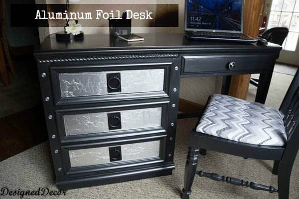 black painted desk with aluminum foil drawers