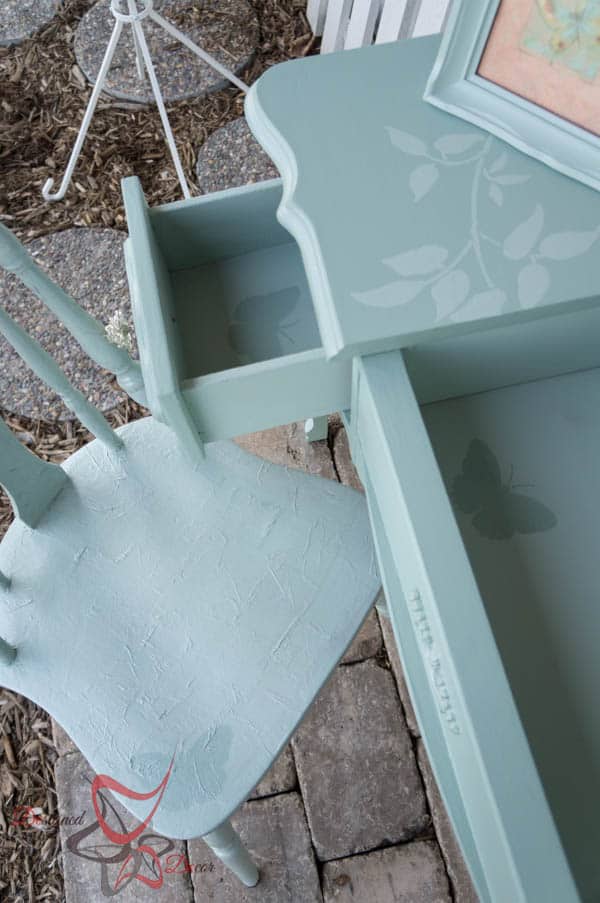 green painted desk with a butterfly stencil 