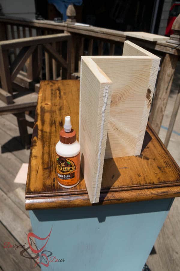 Using wood glue to secure wind bottle holder