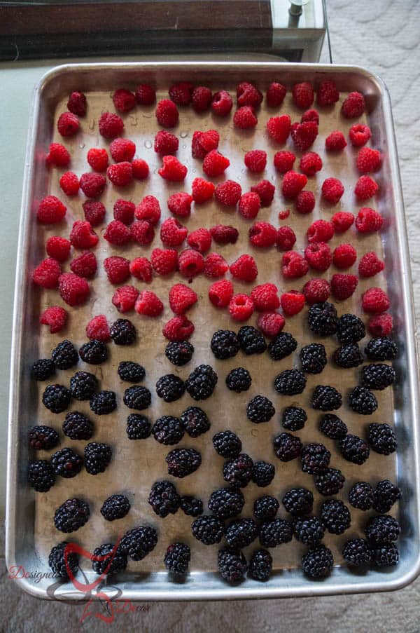 image of a tray of fresh raspberries and blackberries 