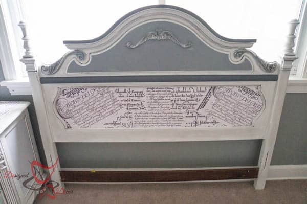 painted headboard with wrapping paper decoupage