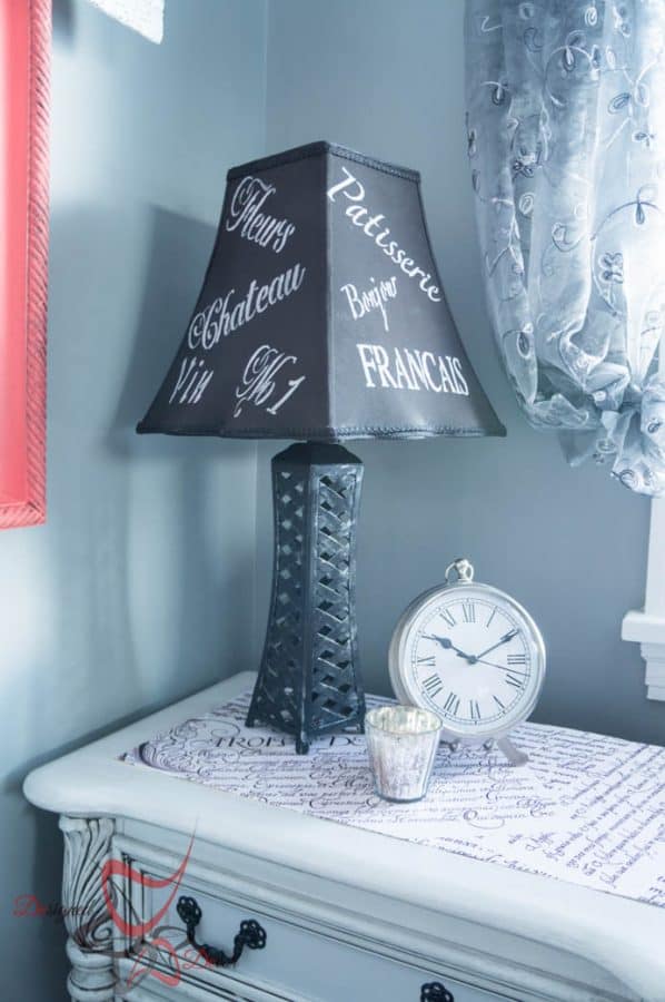 bedroom makeover with a side table and a French inspired lamp