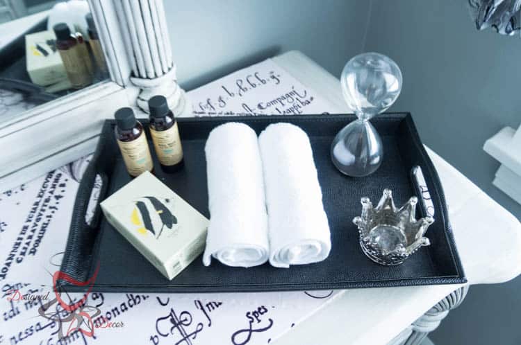 image of a serving tray with soap, lotion and washcloths 