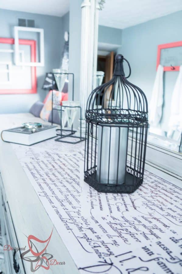 black decorative bird cage on a dresser