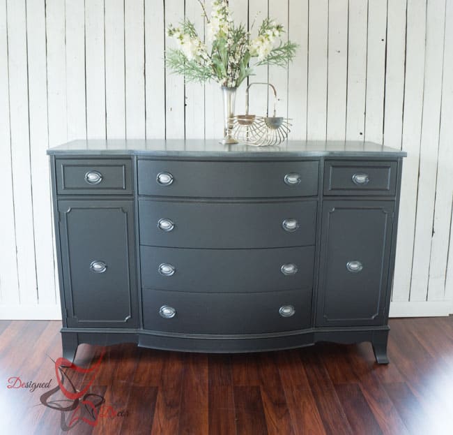 Metallic black painted bow front dresser