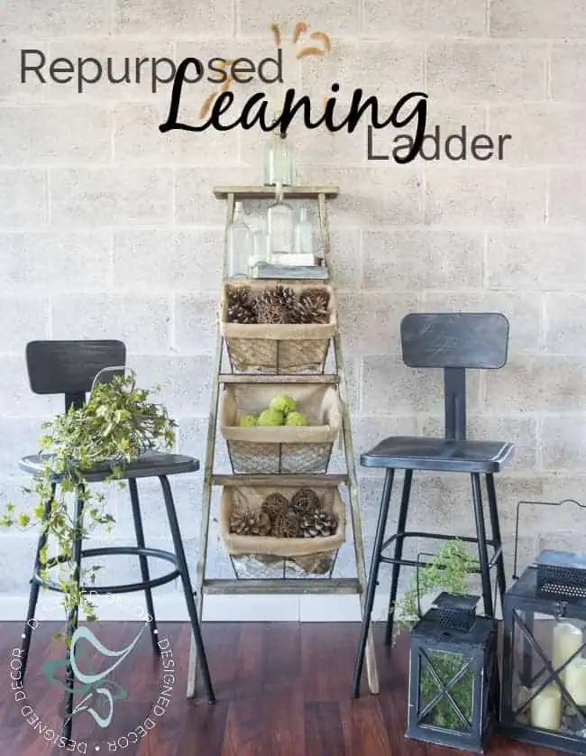 Looking for a great repurposed leaning ladder storage idea. Look no further than using an old wood ladder and a few wire storage baskets. Come over to see how easy it is to make. www.designeddecor.com wire-basket-ladder-repurposed-leaning-home-decor-storage-pinnable
