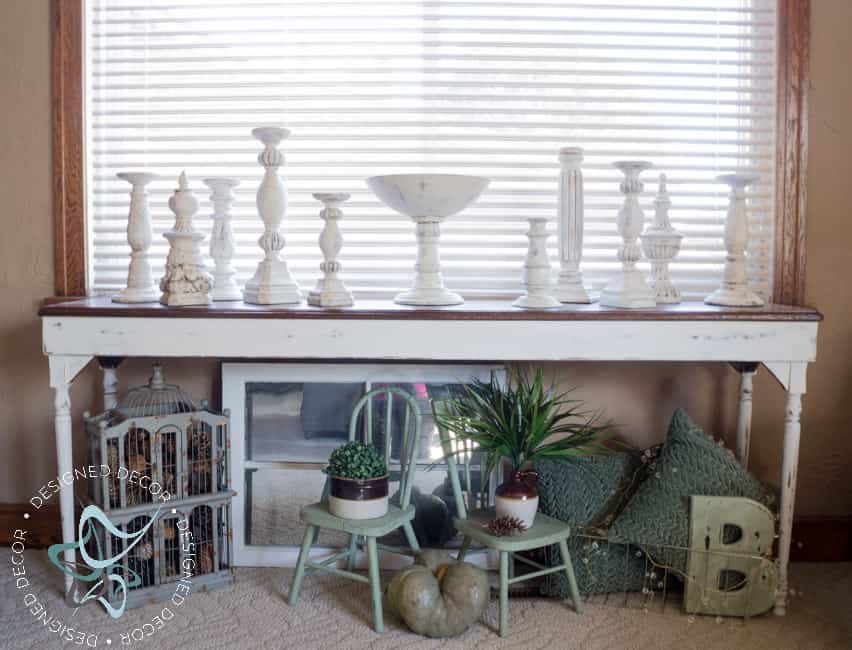 sofa table with layered painted candle holders