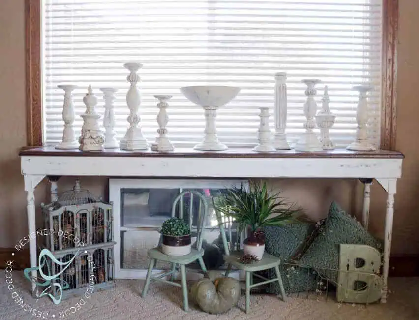 decorating -diy-aged-layered-painted-candlesticks sofa table with layered painted candle holders