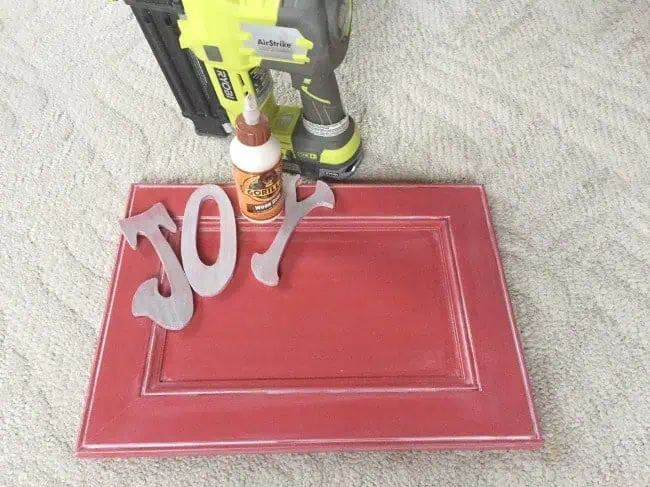 Joy-Holiday-Sign-Repurposed-Cabinet-Door-Gorilla-Wood-Glue-Ryobi-Air-Nailer joy-board-repurposed-cabinet-door