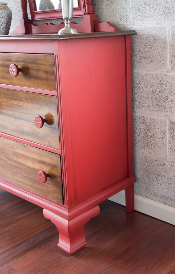 side view of a red chalk painted dresser