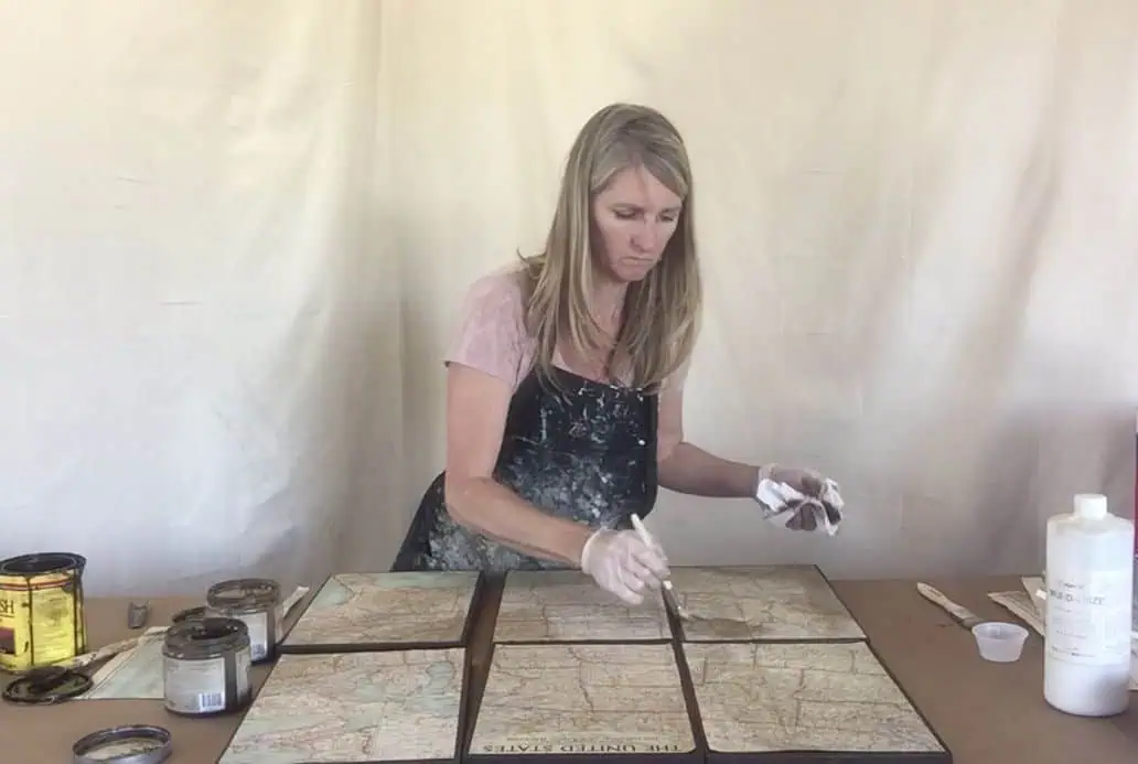use furniture glaze and wood stain to age map pieces