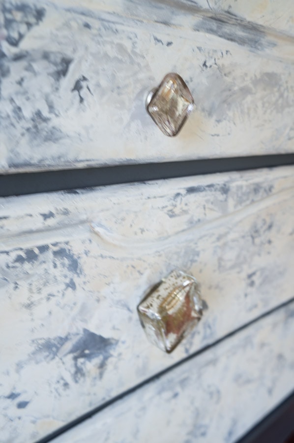 glass knobs on a plaster painted dresser