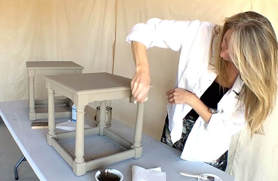 lady painting end tables