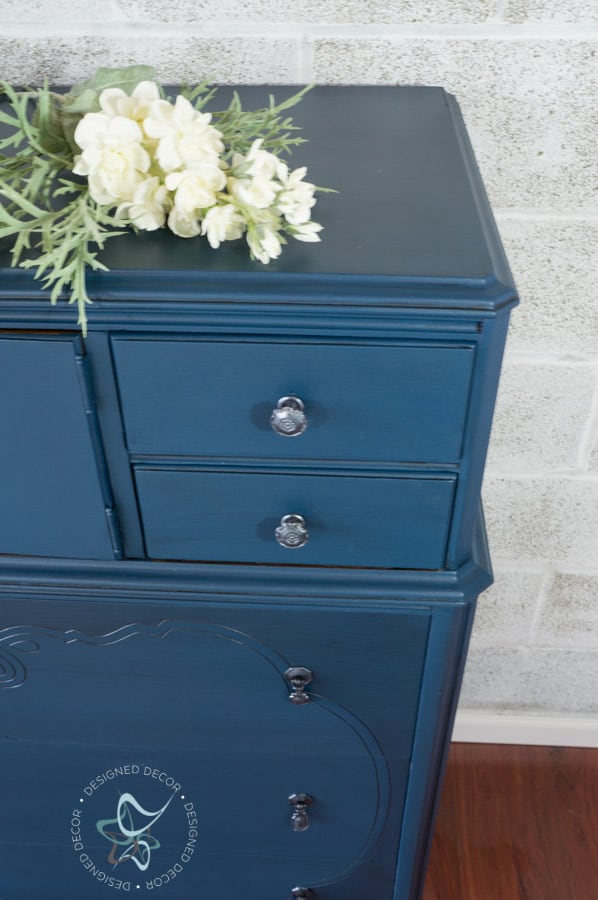 close up of a blue painted dresser