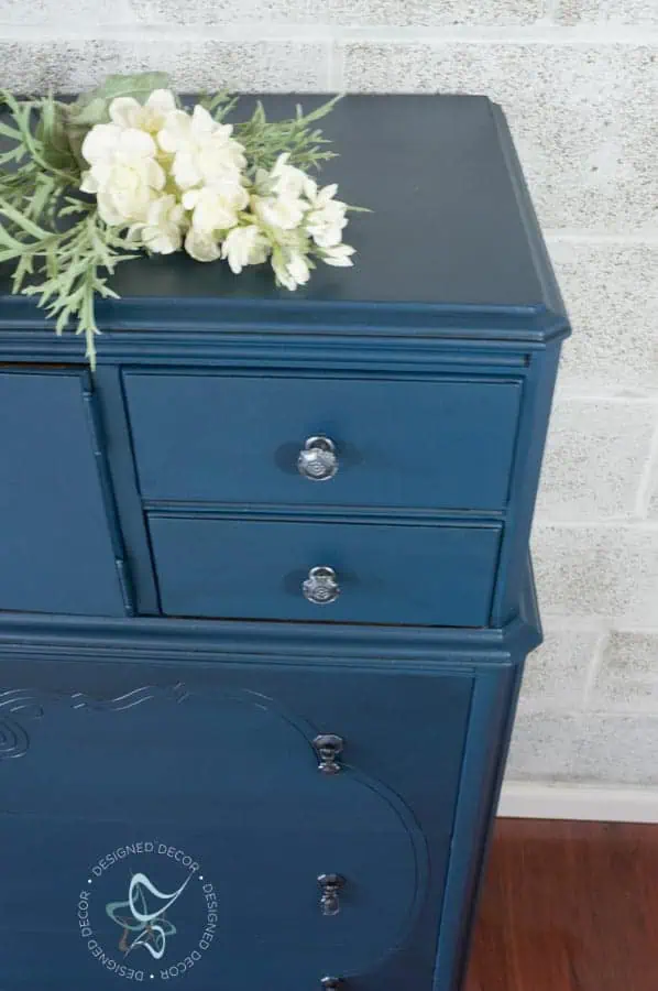How to paint original furniture hardware - Designed Decor close up of a blue painted dresser