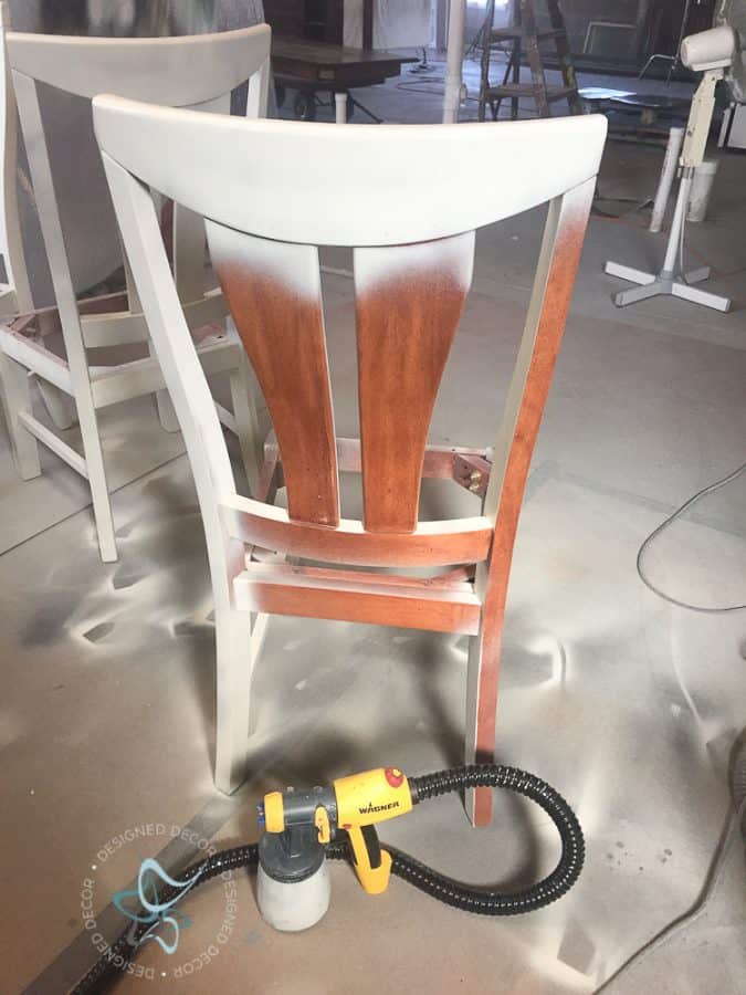 image of a furniture paint sprayer and a wood chair being painted