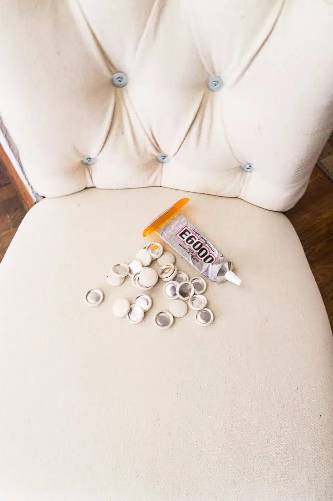DIY-tufting-with -power-tools- image of button covers being glued into the tufted points of the chair