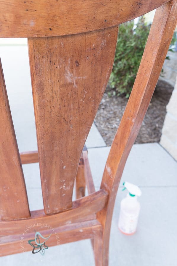 sanding a wood chair