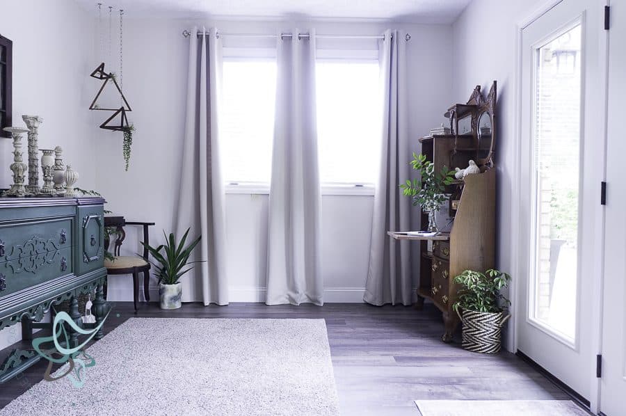 Entryway with a vintage secretary desk and modern traditional window treatments