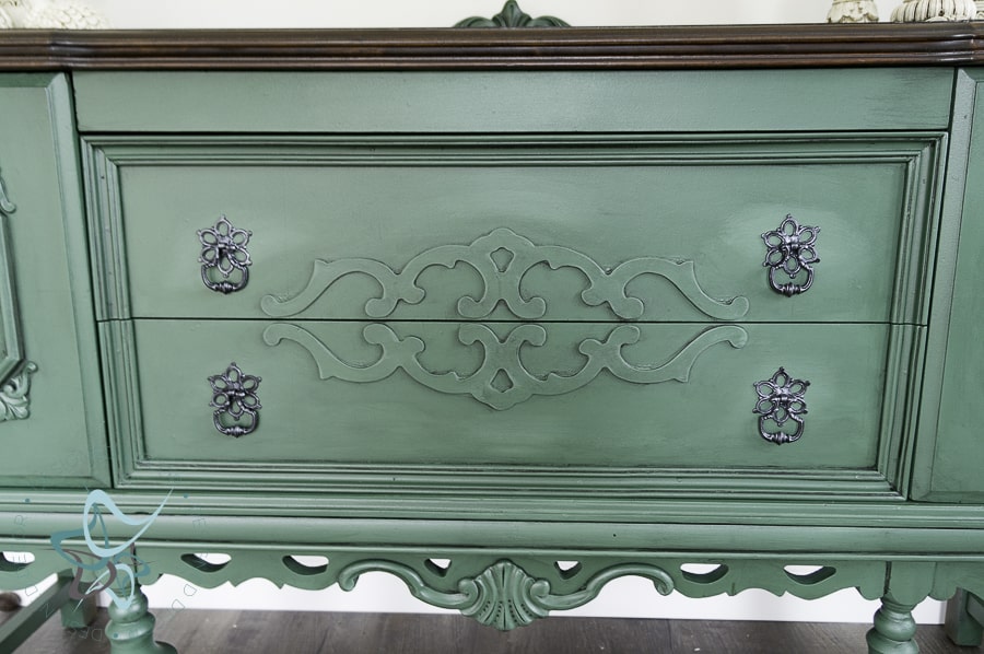 close up of a green painted buffet