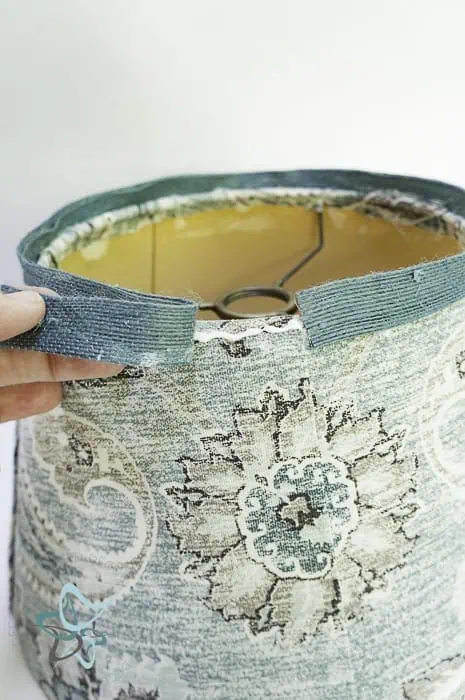 glue piping to edges of fabric covered lampshade
