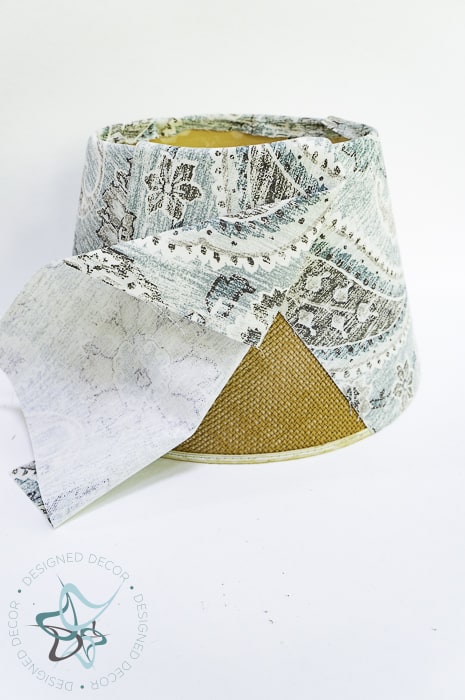 align fabric on lampshade and glue with fabric glue