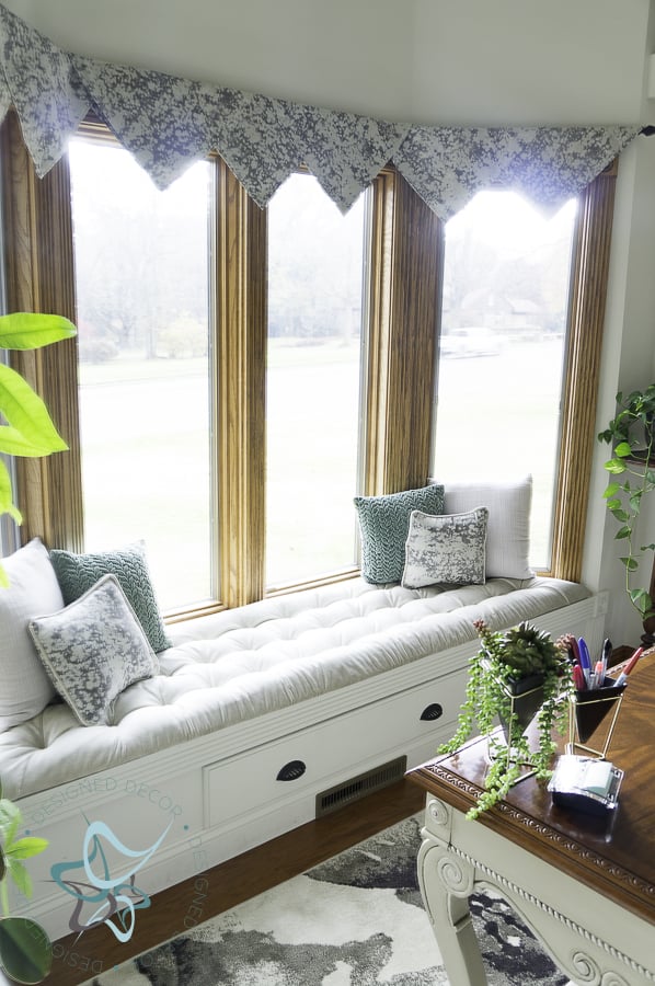 view of bay window with a built in bench seat 