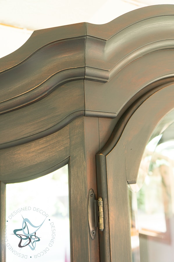 close up of a cabinet painted in natural distress paint technique