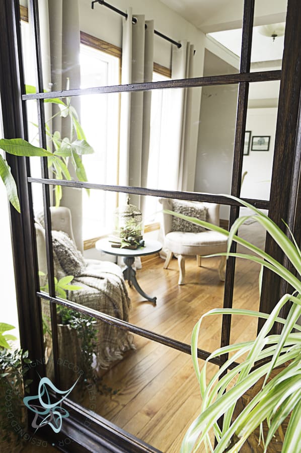 close-up view of oversized leaning floor mirror