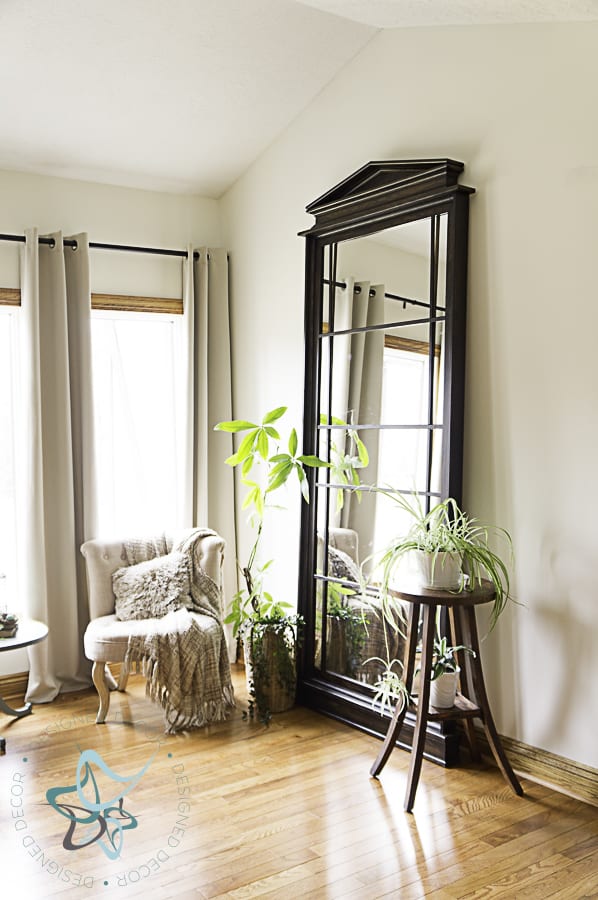 Dark stained leaning floor mirror