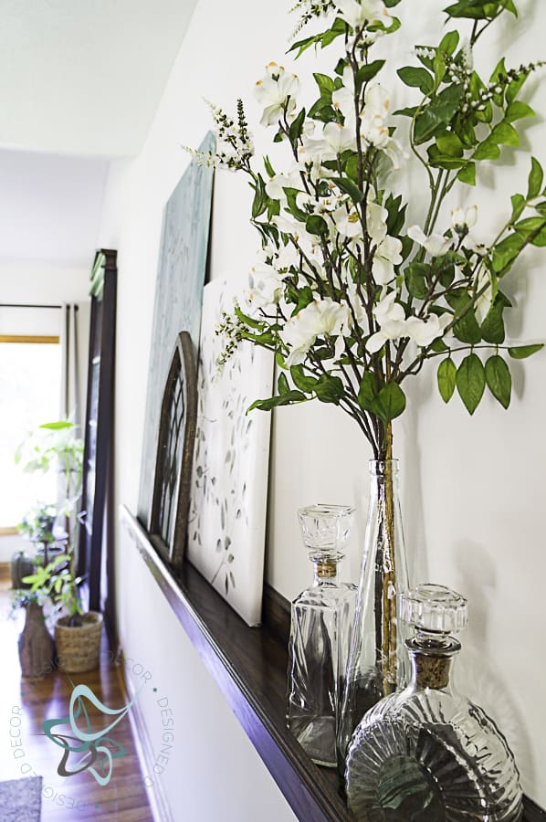 Decorative accessories sitting on a picture ledge