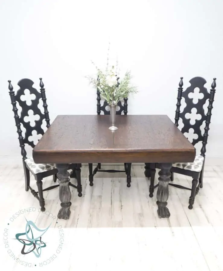 antique table with stained top and painted claw foot legs