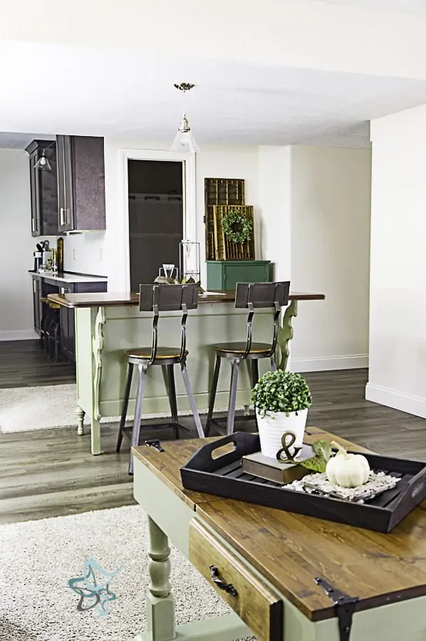open concept living room and kitchen with a dresser converted to a kitchen island island