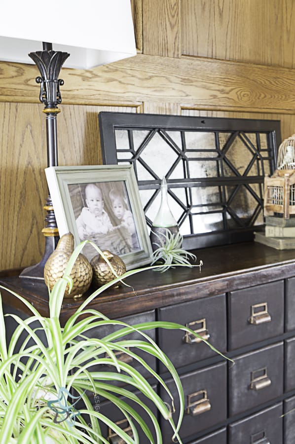 image of an apothecary cabinet with decorative accessories