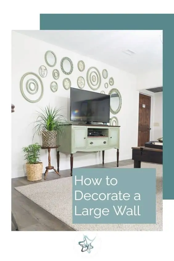 How to Decorate Large Wall Spaces- Decorating to scale image of a media center with oval wall decor hanging above it to show hoe to decorate a large wall