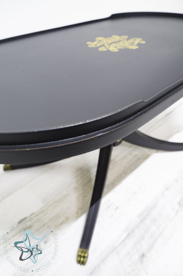 close up image of black painted coffee table