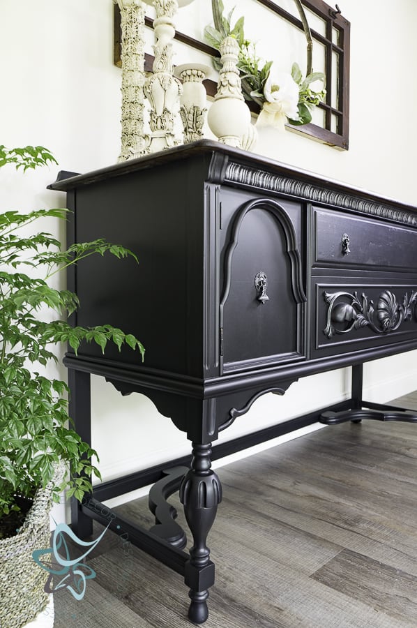 image of a black painted buffet with silver metallic accents