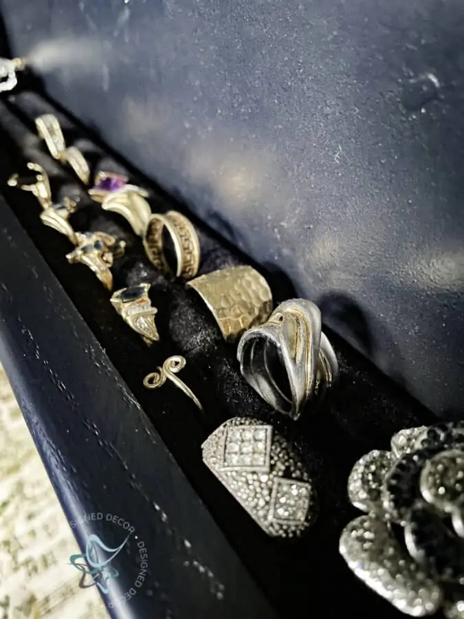 close up image of rings in a black velvet foam ring holder