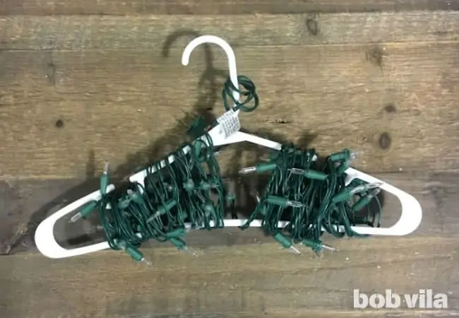 wrap Christmas lights around a plastic hanger for storage