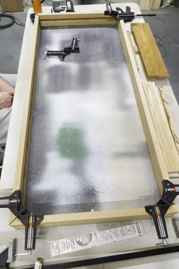 assembling a wood frame with clamps at the corners
