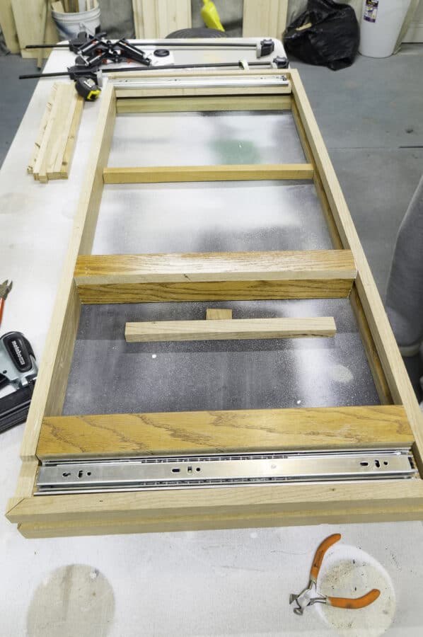 image of the wood frame being assembled with center support bars