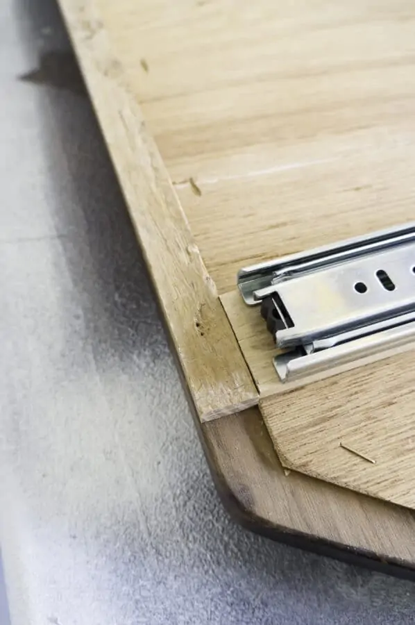 image of sliding hardware placed on the back of the wood mirror