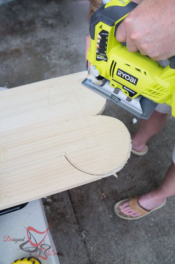 cutting a wood board with a jigsaw