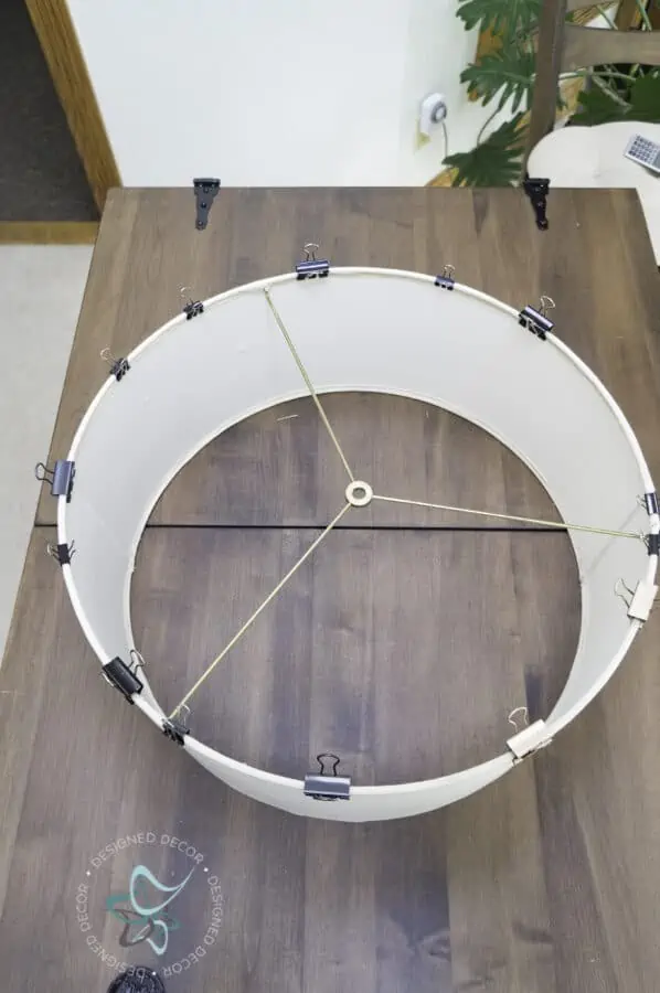 lampshade with binder clips on the lampshade edges