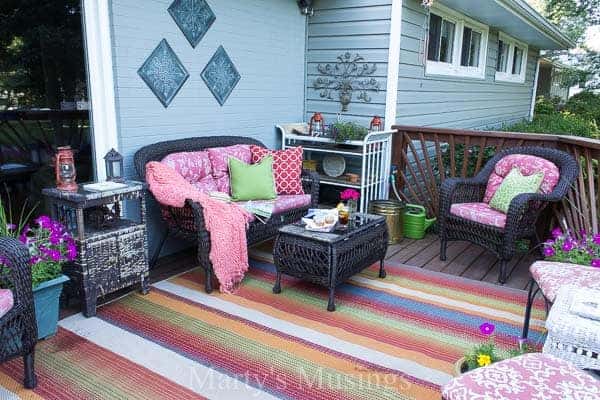 outdoor wicker furniture with bright colored pillows and accessories