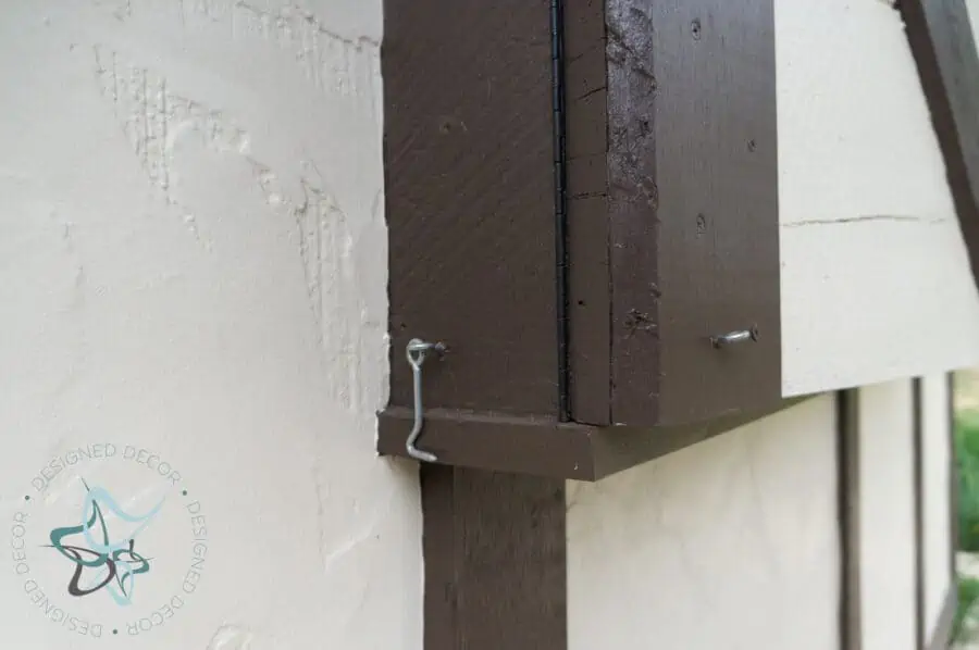 adding a hook and eye to hold the cabinet doors open