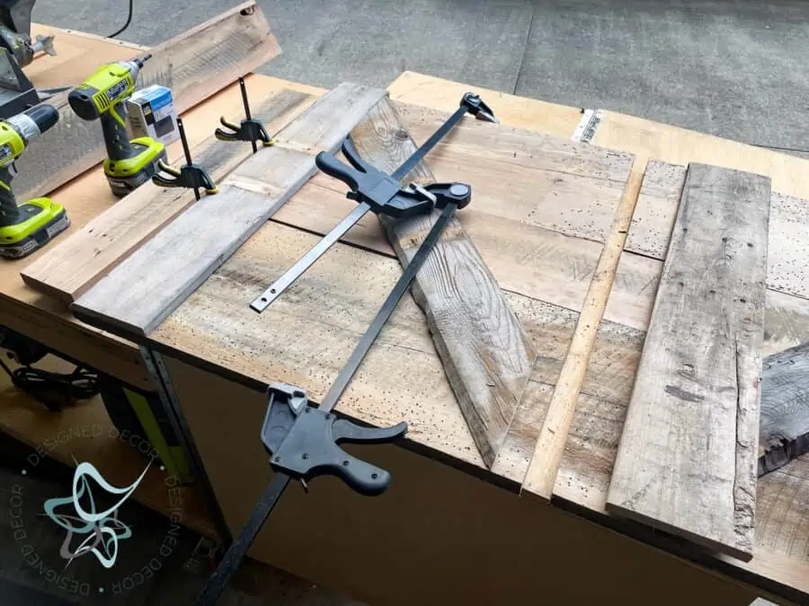 using clamps to hold the tv cabinet doors together while drying