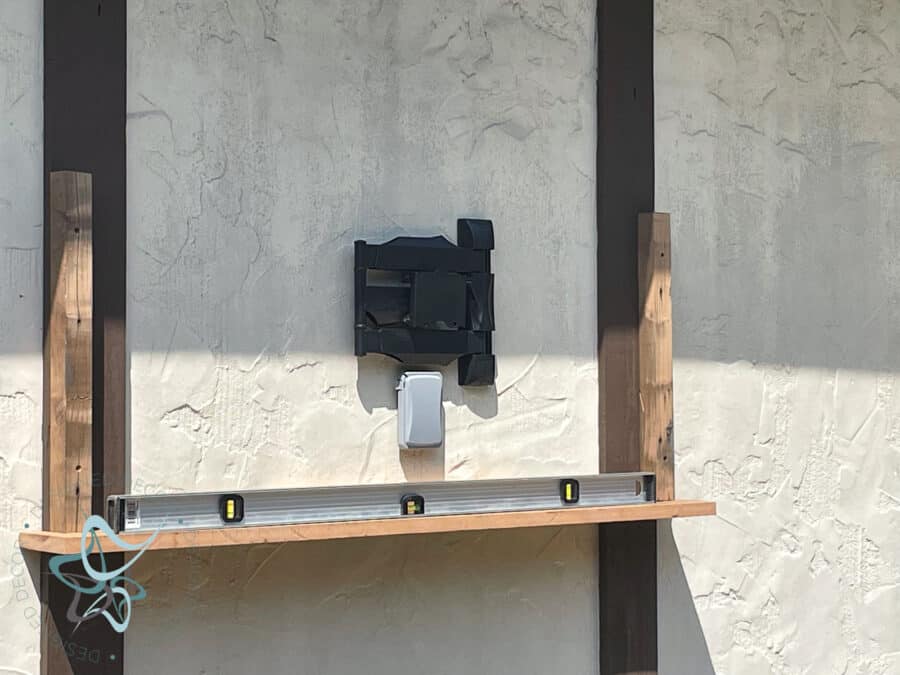 building an outdoor tv cabinet on the side of a garage.